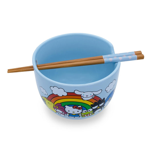 Top view of light blue ceramic ramen bowl with rainbow and characters design, bamboo chopsticks resting inside