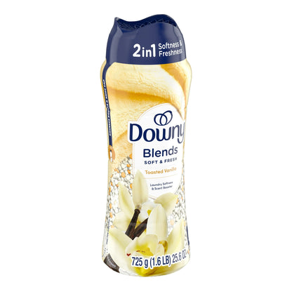 Clothesline with soft, fresh-smelling laundry outdoors, Downy Blends bottle in foreground  