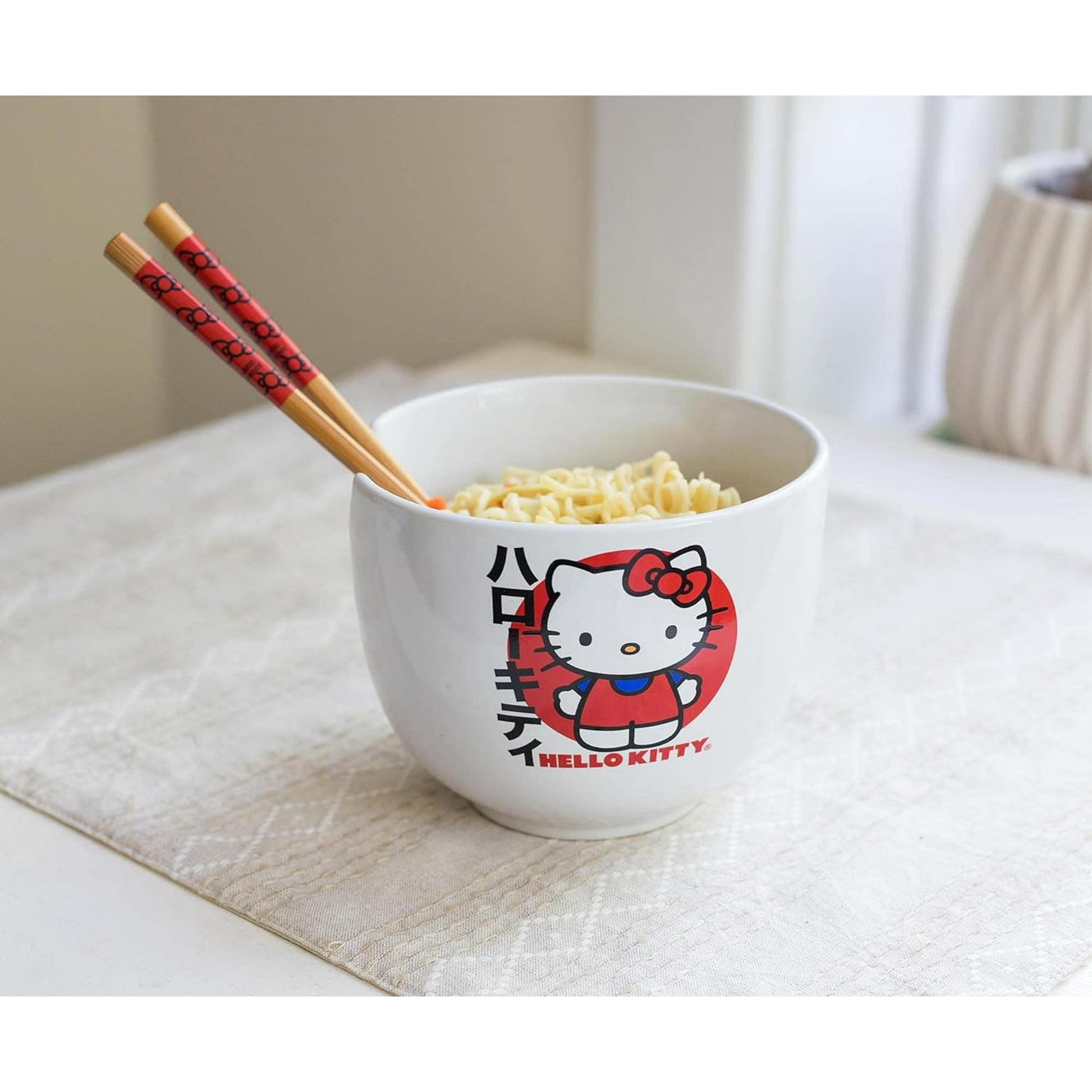 Top view of Hello Kitty ceramic ramen bowl with bamboo chopsticks resting on the notch