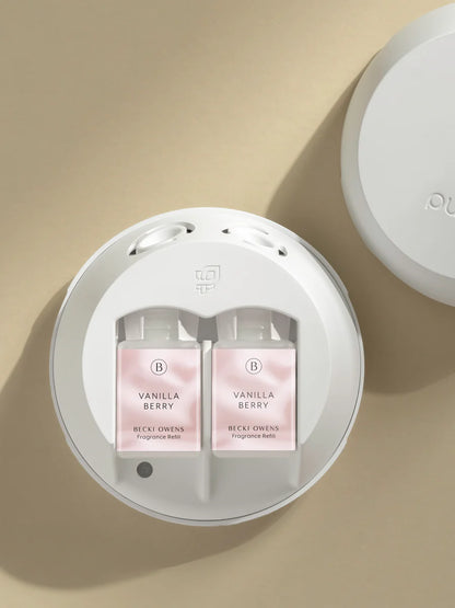 Top view of Pura Smart Scent device fitted with two Vanilla Berry fragrance refill bottles