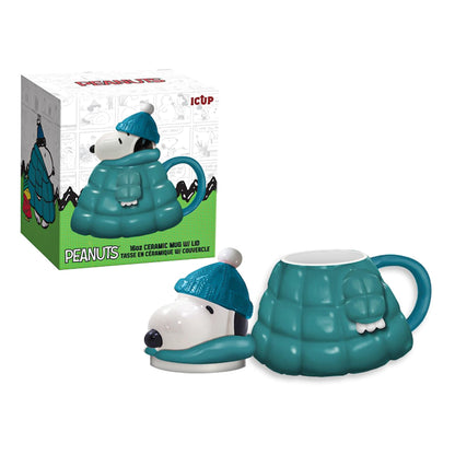 Peanuts Snoopy ceramic mug shaped like Snoopy in a blue puffy jacket with matching lid featuring his head and winter hat, alongside product packaging