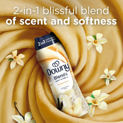 Bottle of Downy Blends laundry scent booster next to fresh vanilla pods  
